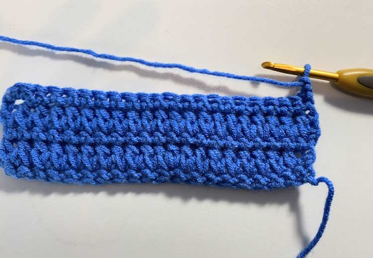 Forked half double crochet on the hook, worked in a royal blue 100% acrylic yarn.
