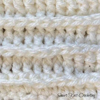 Front Post Double Crochet Rib swatch worked in white yarn