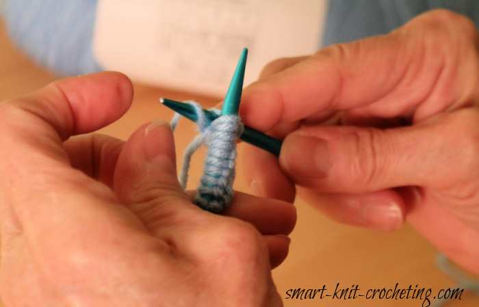Step two for doing the garter stitch. The garter stitch is being demonstrated with a ball of blue yarn