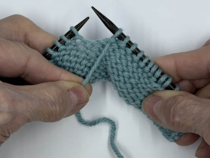 Step one for making the german short row on the purl side of the fabric