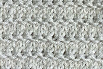 Thumbnail image of the granite lace knit stitch worked in a beige colored yarn Thumbnail image of the granite lace knit stitch worked in a beige colored yarn