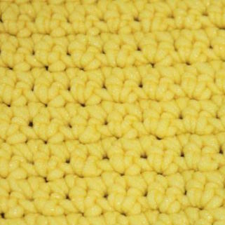 crochet grit stitch worked in yellow yarn
