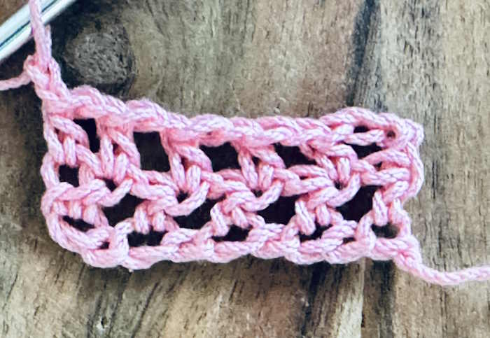 Half double crochet mess stitch showing 2 rows of work