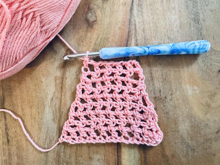 A swatch of the half double crochet mess stitch decreases