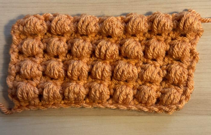Half double crochet puff stitch shown on the right side of swatch Half double crochet puff stitch shown on the right side of swatch