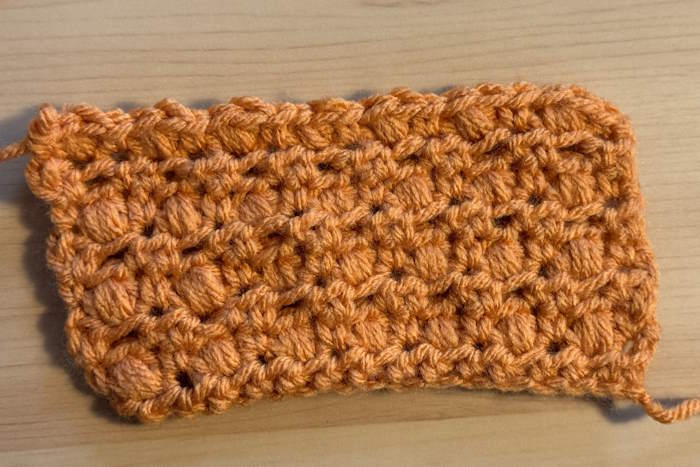 Half double crochet puff stitch shown on the wrong side Half double crochet puff stitch shown on the wrong side