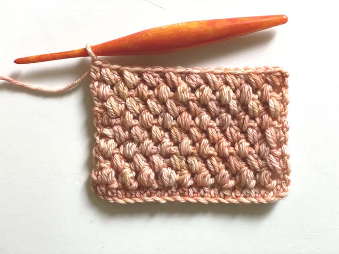 A sample of the half double crochet puff stitch worked in 100% superwash merino yarn A sample of the half double crochet puff stitch worked in 100% superwash merino yarn