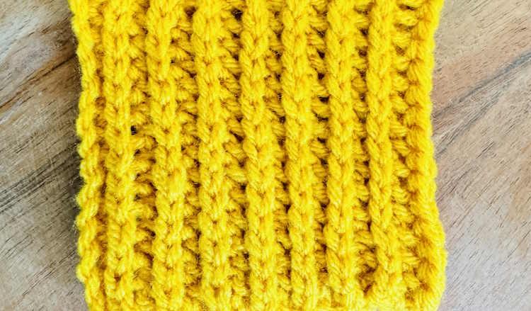 Half double crochet slip stitch ribbing in gold acrylic yarn