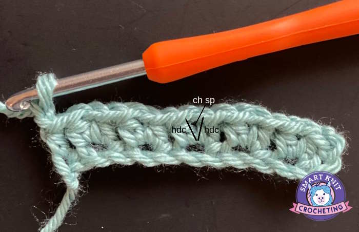 half double crochet v stitch tutorial with marked and labeled parts