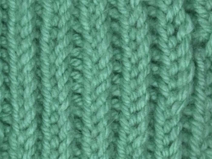 The wrong side showing of the herringbone stitch