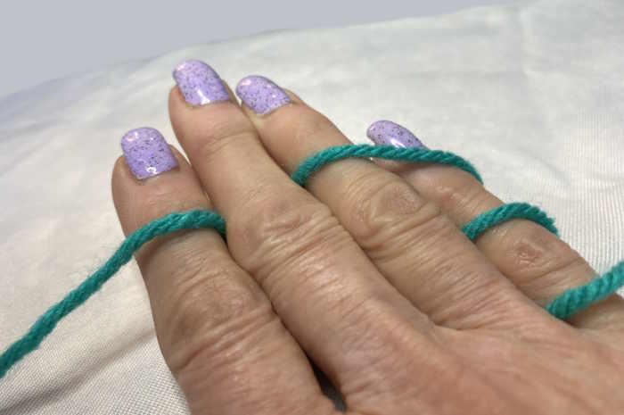 Hold yarn in your nondominant hand.  This way of hold yarn is for left handed crocheters Hold yarn in your nondominant hand.  This way of hold yarn is for left handed crocheters