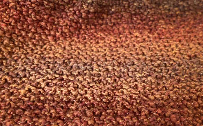 Closeup of garter stitch worked in homespun yarn.