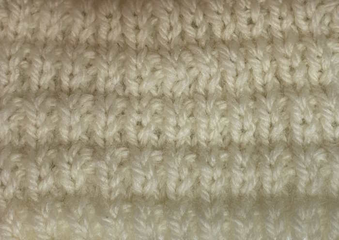 The right side showing of the interrupted rib knit stitch pattern