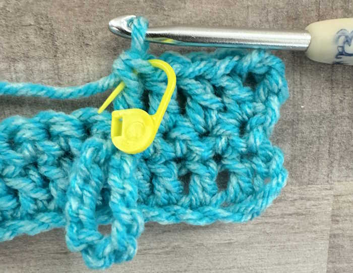 A stitch marker indicates where to make the slip stitch in the Jacob's Ladder Stitch A stitch marker indicates where to make the slip stitch in the Jacob's Ladder Stitch