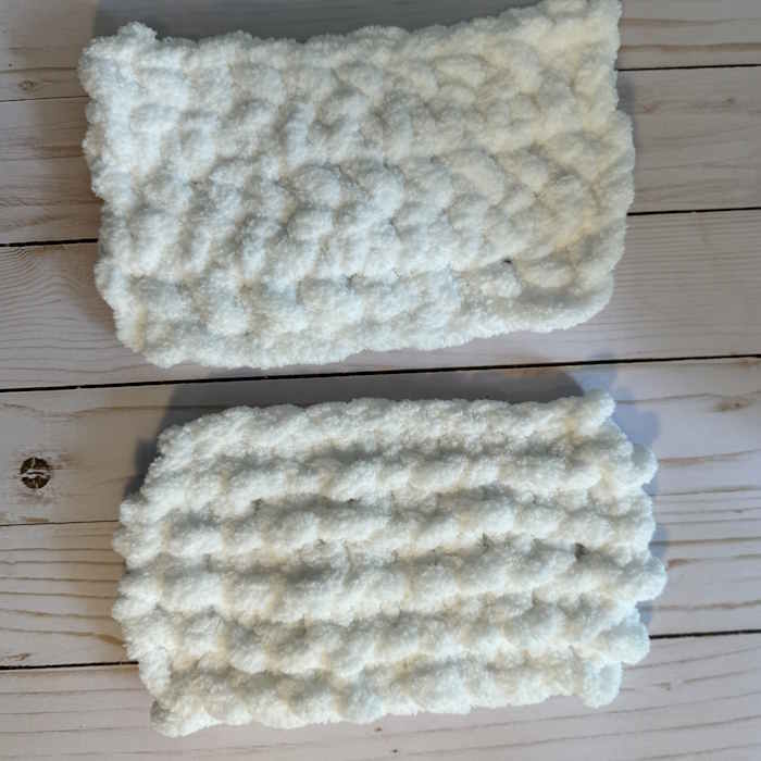 Two swatches of jumbo yarn, one knit in a garter stitch pattern and the other of a single crochet stitch pattern.
