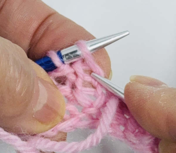 Showing where to insert the right needle when making a k1b. Showing where to insert the right needle when making a k1b.