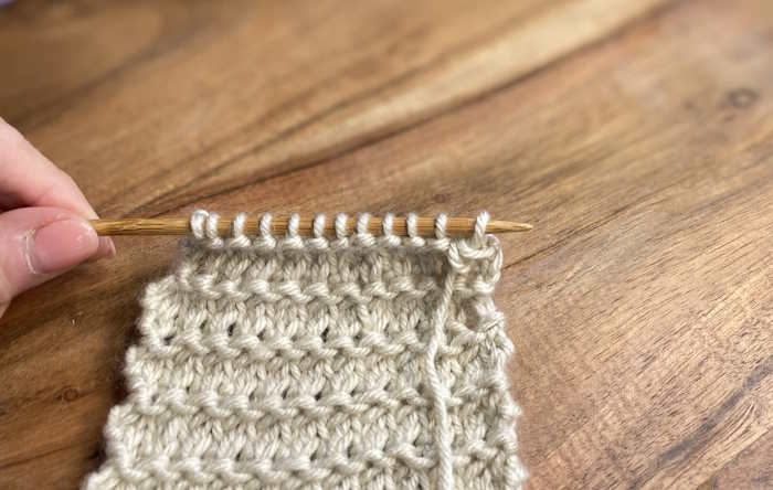 Step 5 of a five part series on how to make the Knit two together knitting decrease.