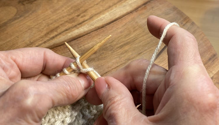 Step Four of the step-by-step tutorial on how to do the KFB (knit, front, back)