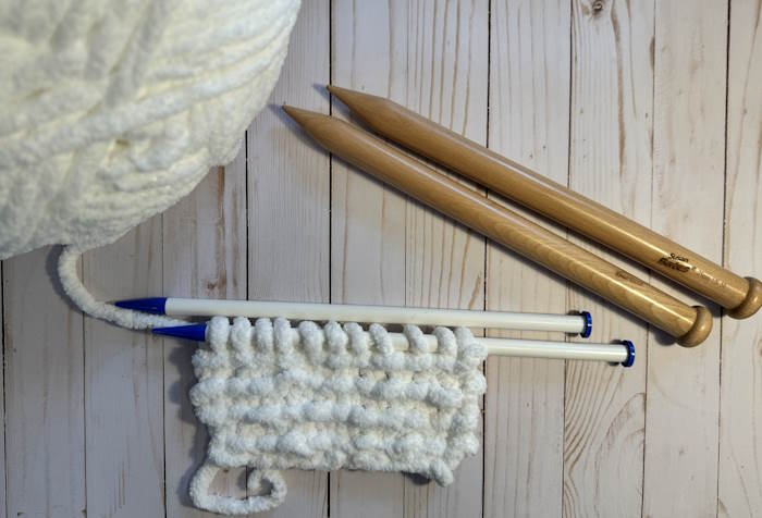 A swatch of jumbo yarn on knitting needles