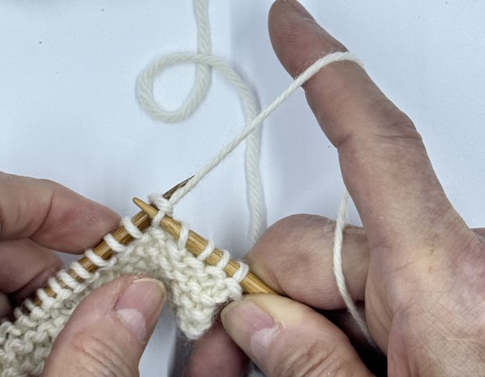 step 3 for making the knit stitch continental style