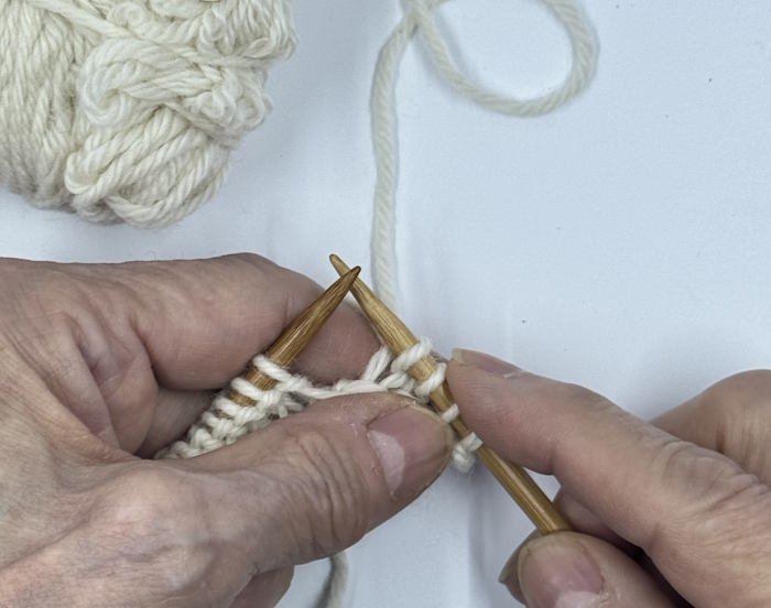 Step 4 for using the continental method to make the knit stitch.,