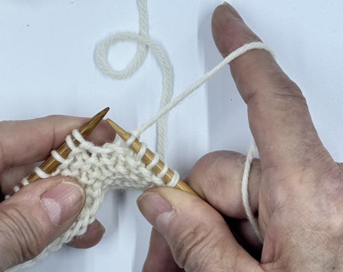 Step four for making the knit stitch English Style