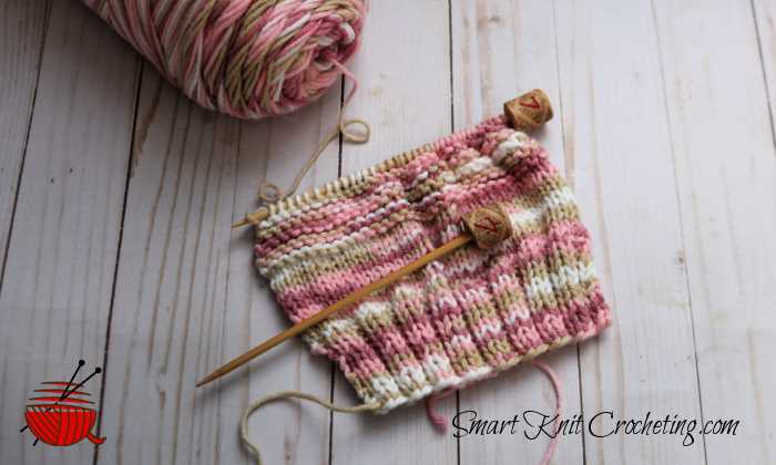 Knitted Hand Mitts using 2 double-pointed knitting needles with wine cork ends.