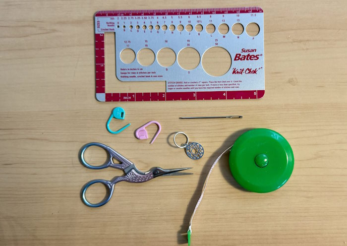 An assortment of small tools needed for knitting An assortment of small tools needed for knitting