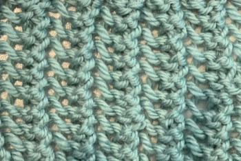 A thumbnail of the lace stitch worked in teal.