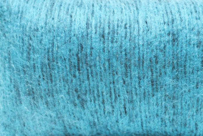 Swatch of stockinette stitch knit with mohair yarn