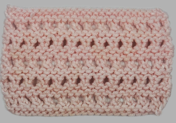 The wrong side showing on a  swatch of the open honeycomb stitch