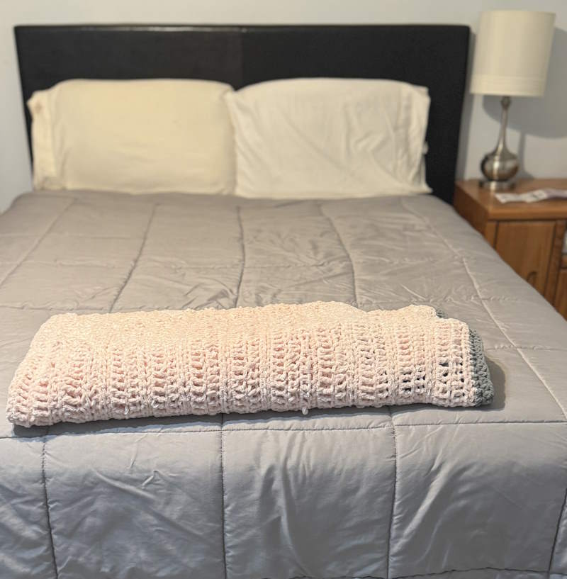 Plush yarn is used to make this queen sized crochet blanket Plush yarn is used to make this queen sized crochet blanket