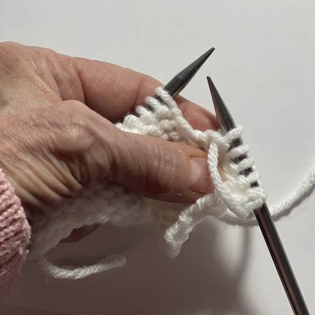 Step-by-step tutorial for making the purl stitch.  This is the fourth and last step for making the purl stitch. Step-by-step tutorial for making the purl stitch.  This is the fourth and last step for making the purl stitch.