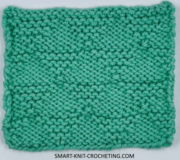 Wrong Side of the Knit Pyramid Pattern The wrong side is showing on a knitted swatch worked in the pyramid pattern