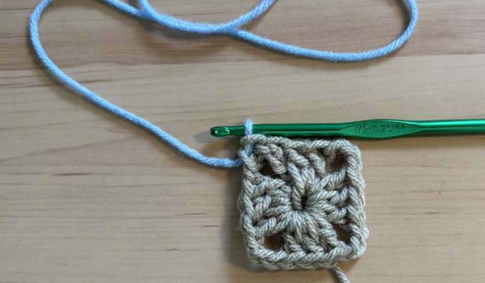 Red Heart Granny Square Yarn  showing a square worked with the correct tension.