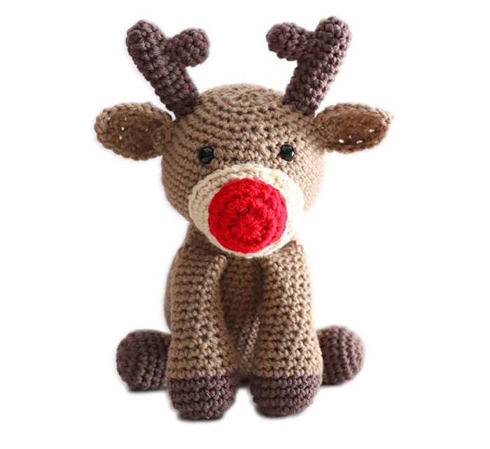 Crocheted toy reindeer in brown yarn