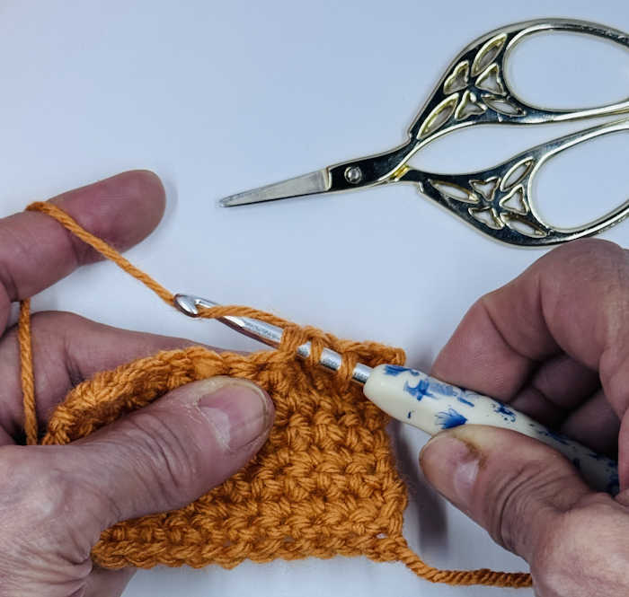 step 3 of how to make a single crochet decrease stitch. step 3 of how to make a single crochet decrease stitch.