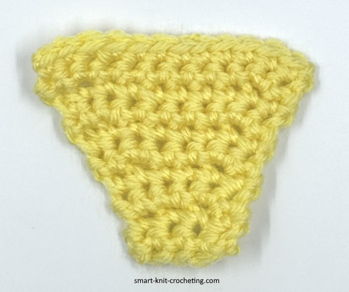 A swatch of single crochet stitches where increases are made using the invisible technique.