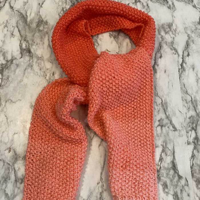 A scarf worked in seed stitch using an ombre yarn