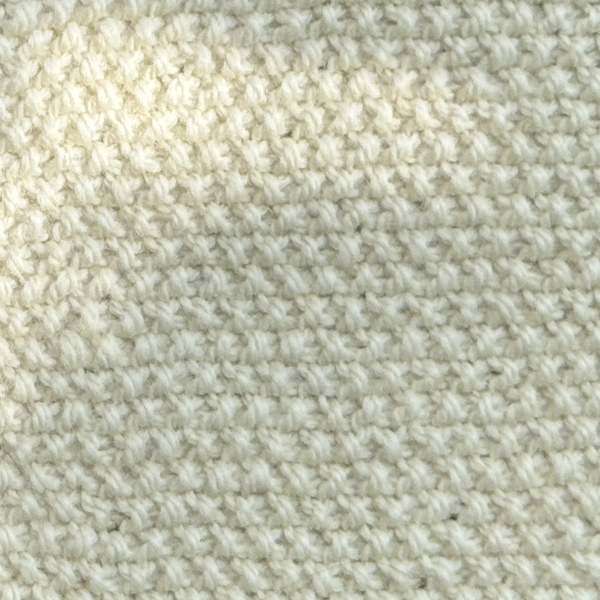 A swatch of seed stitch worked in beige yarn