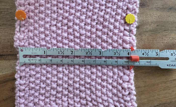 A swatch of seed stitch showing a ruler marking off 20 stitches A swatch of seed stitch showing a ruler marking off 20 stitches