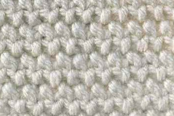 Knit seed stitch worked in white close up view