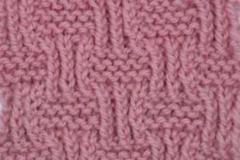 The knit shingle stitch, made with knit and purl stitches creates a highly textured fabric