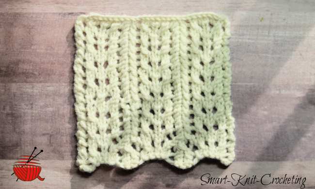 A swatch worked in cream color yarn of a simple lace design A swatch worked in cream color yarn of a simple lace design