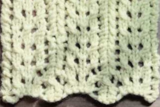 A swatch of simple lace worked in white yarn (thumbnail)
