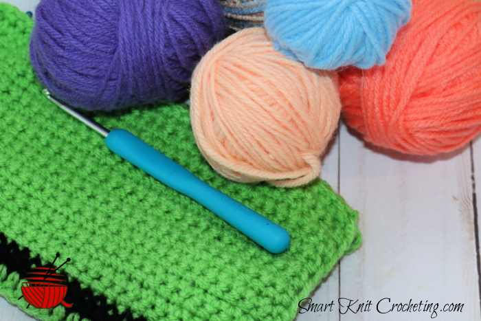 Single crochet swatch with hook and yarn