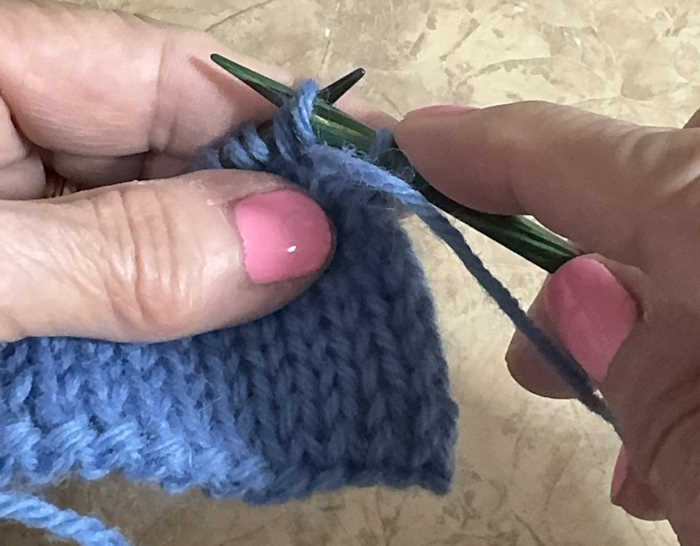 Demonstration of how to make the slip one, purlwise, with yarn in front.