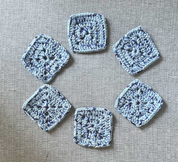 six solid granny squares are shown worked in blue yarn.