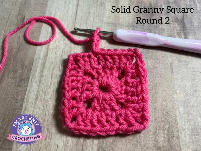 Two rounds of the solid granny square were completed in bright pink.
