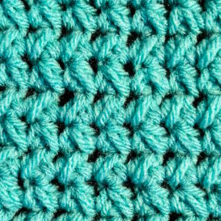 staggered half double crochet close up worked in teal yarn